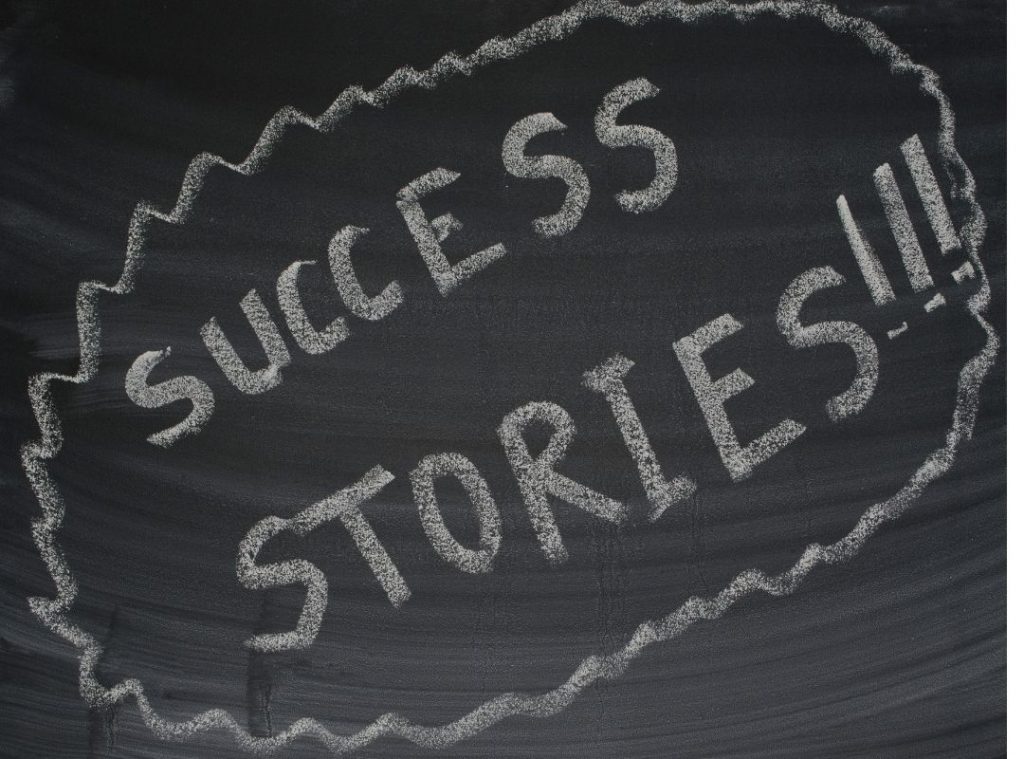 success stories written on blackboard